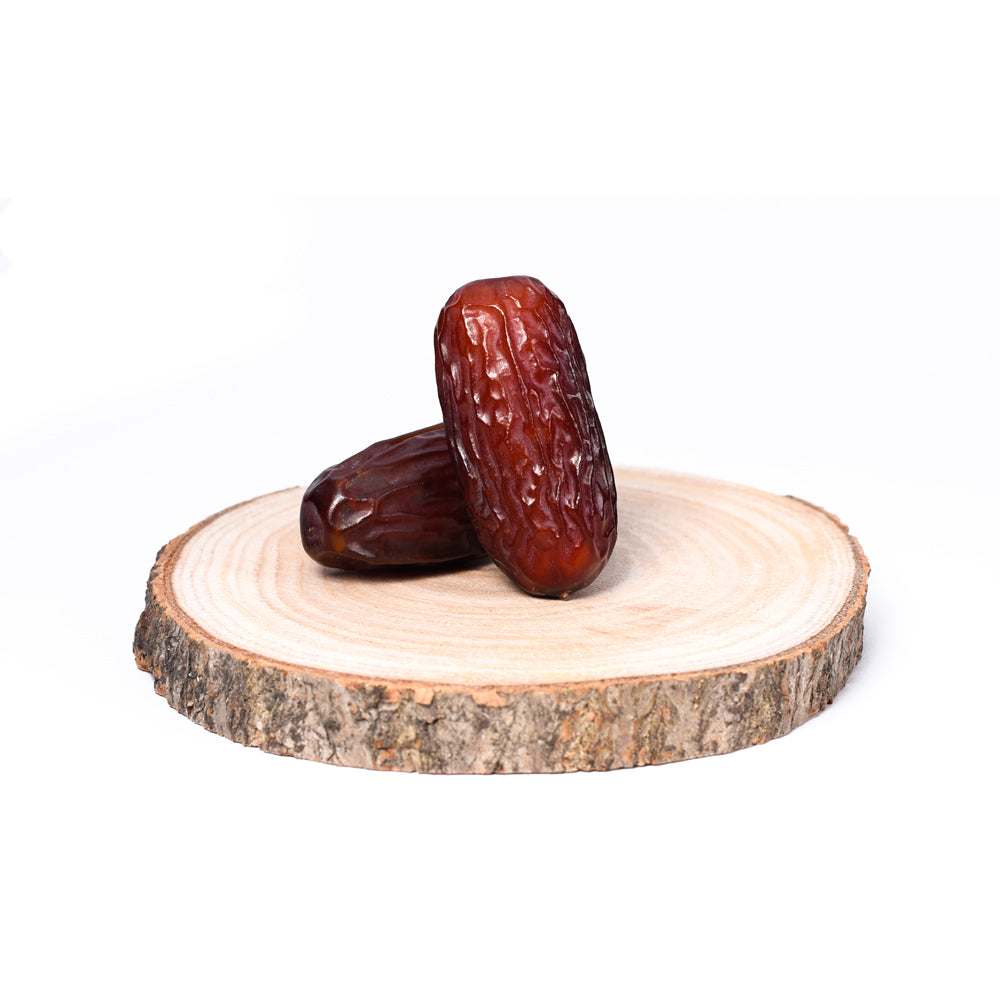Arabische Mabroom Datteln mit zartem, süßem Geschmack, ideal für gesunde Snacks und Desserts.